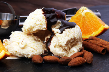 scoop of orange ice cream with almond and chocolate
