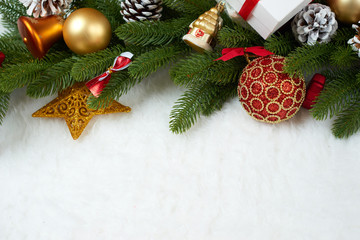 Fototapeta na wymiar christmas decoration on fir tree branch closeup, gifts, xmas ball, cone and other object on white blank space fur, holiday concept, place for text