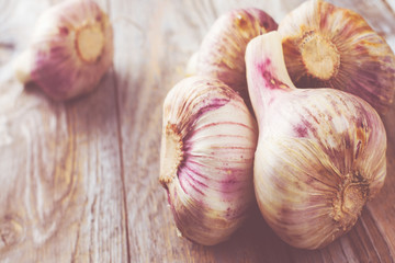 Garlic bulbs on wooden table