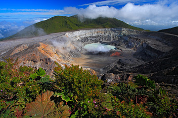 Poas volcano in Costa Rica. Volcano landscape from Costa Rica. Active volcano with blue sky with...