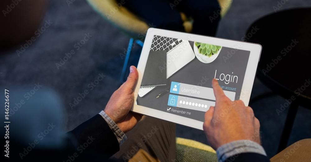 Aufkleber close-up of hands using log in page on tablet pc