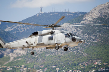 Black hawk helicopter rescue team.Approach landing, exhaust gas, Aviation antennas on mountain...