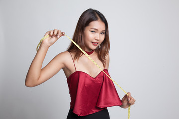 Young Asian woman with measuring tape.