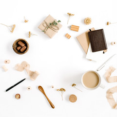 Fototapeta na wymiar Blogger or freelancer workspace with coffee mug, notebook, sweets and accessories on white background. Flat lay, top view minimalistic brown styled home office desk. Brown styled composition