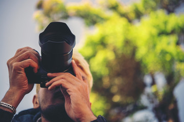 Men hiking with camera in nature.