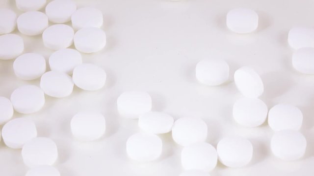 Falling white pills