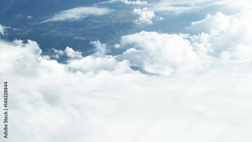 Aufkleber 3d cgi animation of flying through white clouds towards ground visible from distance
