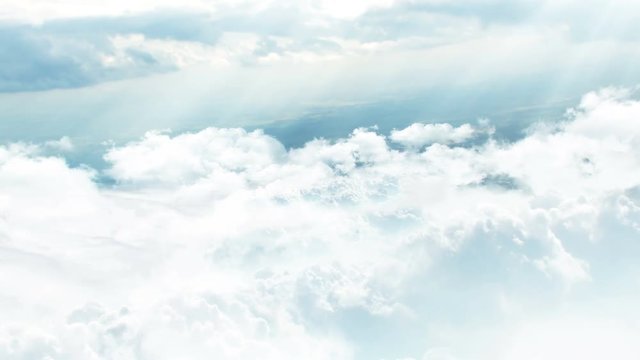 3D CGI animation of flying through white fluffy clouds with rays of sunshine coming from above 