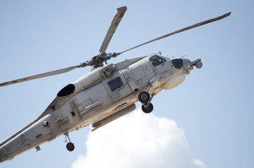 Fototapeta na wymiar Black hawk helicopter nose up take off blue sky rescue team