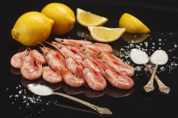 The scrolls lie on a black background, an elective focus