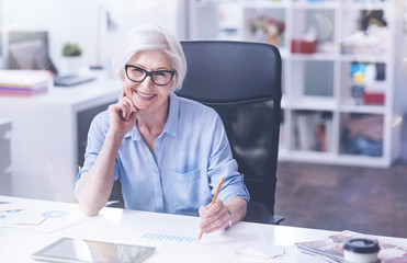 Friendly female sitting at her workplace