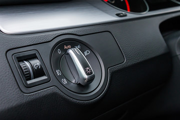 Detail Of The Headlight Button In Car Dashboard