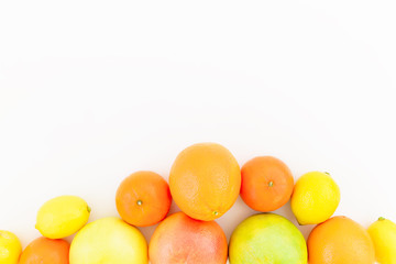 Fresh citrus fruits on white background. Flat lay, top view. Fruits background.