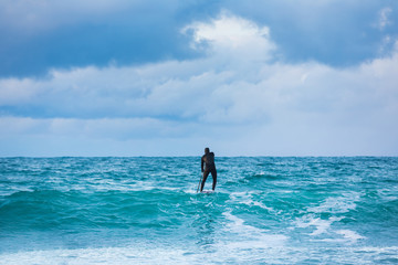Fototapeta na wymiar Training surfers in cold waters of Lofotens