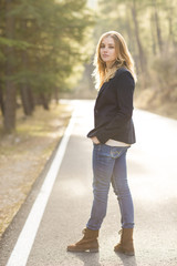 Fototapeta premium Image of pretty businesswoman looking at camera on natural space