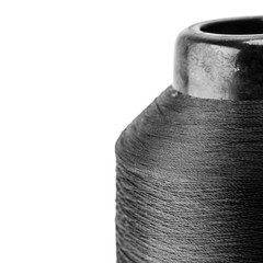 reel black synthetic thread. textile concept. abstract background