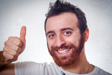 Young smiling man with ok sign