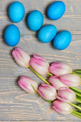 traditional eggs painted in blue color with pink beautiful tulips