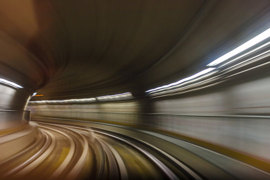 Fototapeta Inside tunel blur abstract scene traveling by train looking forward In Italian subway