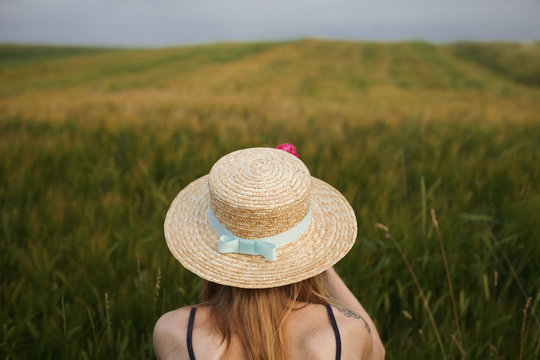 Caucasian woman in field of tall grass