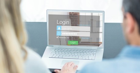 Man and woman looking at login screen on laptop