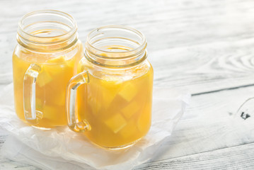 Mango juice in mason jars