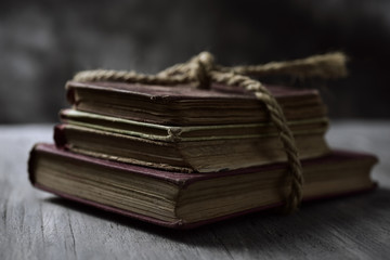 old books tied with a string