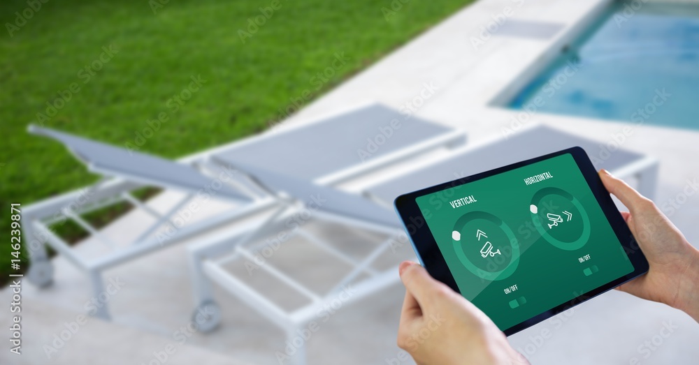 Poster hands using smart home application on digital tablet at poolside