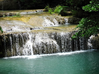 Beautiful forest waterfall at Erawan waterfall National Park Kanjanab. Soft focus with low key.