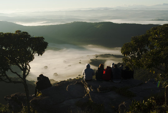 People admiring the sunrise in Brazil