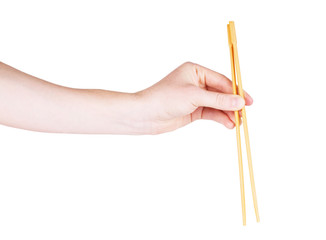 chopsticks with hand on a white background isolated