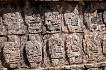 Detail Carvings at the platform of Skulls in the ancient Mayan ruins of Chichen Itza in Mexico.