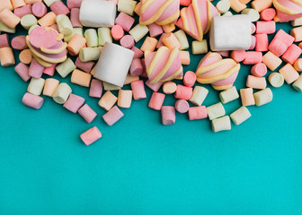 Marshmallows Background or texture of colorful mini marshmallows Handful of colorful marshmallows on a blue background