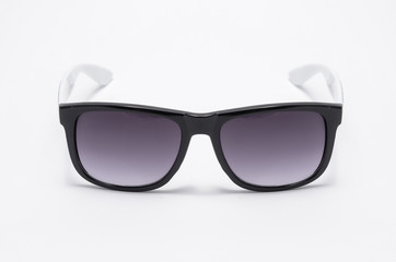 Mens sunglasses in thick black plastic frame isolated on white