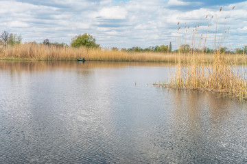 Nature of Ukraine. Spring river landscape with clouds in the sky