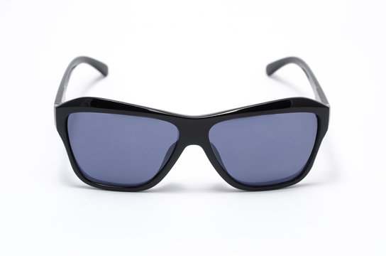 Mens sunglasses in thick black plastic frame isolated on white