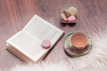 Macaroons, book and tea