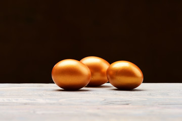 traditional egg painted in golden metallic color