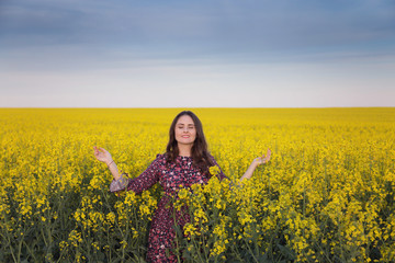 Spring portrait in the rapeseed field