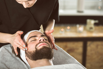 Men's gold mask therapy at beautician's