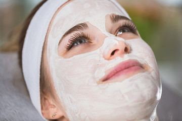 Young woman at enzymatic peeling therapy in spa