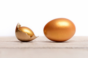 broken easter golden egg shell, future life, luxury and success