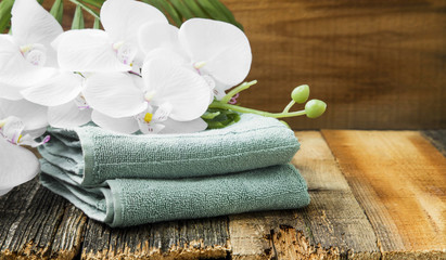 Spa still life with orchid flowers and soft towels