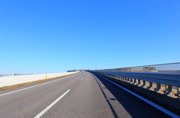 Asphalt road and blue sky