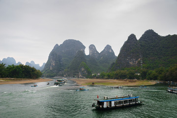  Li river and karst mountains / hills in Yangshuo, Guangxi, China, one of China's most popular tourist destinations.