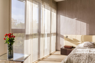 Spacious bedroom in beige colours