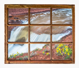 waterfall with wildflowers window view