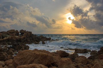 sunset at the sea with rocks.