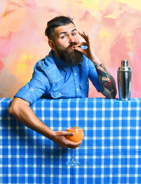 Brutal caucasian hipster holding tropical alcohol fresh cocktail