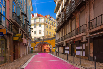 The famous pedestrian Pink street of Rua Nova do Carvalho in the Cais do Sodre area of Lisbon, Portugal © Kavalenkava